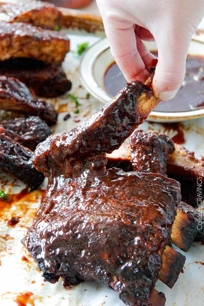 15 minute prep Fall-Off-the-Bone Slow Cooker Barbecue Ribs that everyone goes crazy for! They are slathered in the most incredible rub and barbecue sauce for amazing restaurant flavor. My husband says they are better and more tender than any restaurant! 