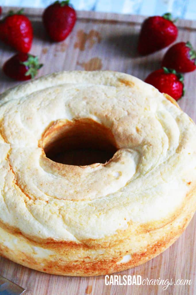 How to make Angel Food Cake French Toast showing the angel food cake on a wood cutting board.