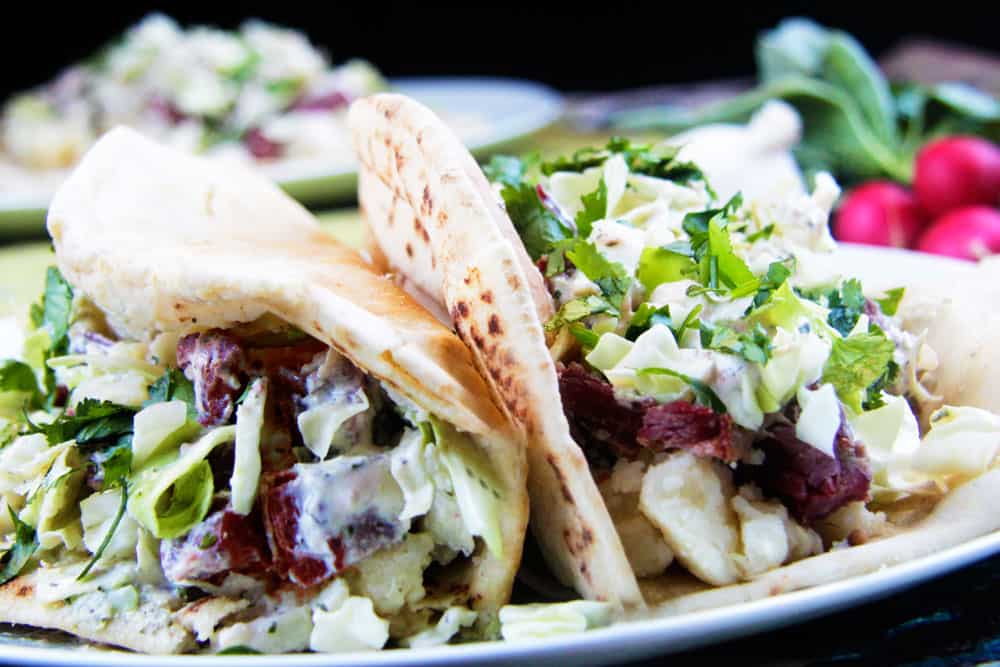 Irish Corned Beef Brisket Pitas with Parmesan Potatoes, Cabbage and Radish Dressing