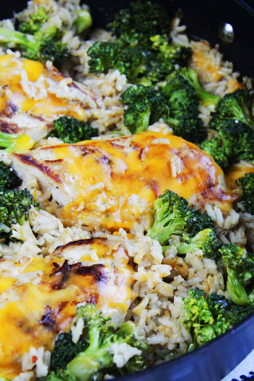 Close up photo of Cheesy Chicken, Broccoli, Rice Skillet.