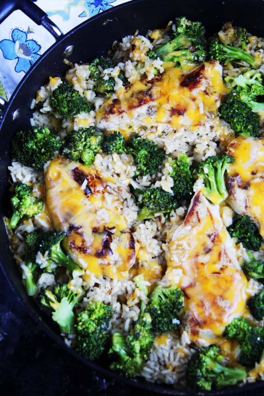 Cheesy Chicken, Broccoli, Rice Skillet with a black skillet.