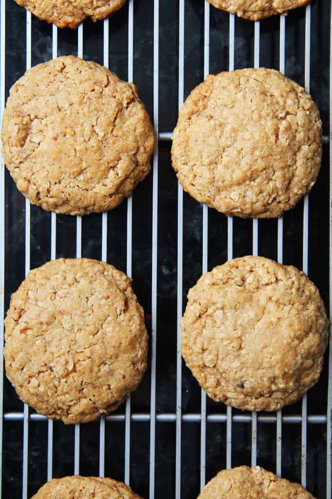 showing how to make oatmeal cream pies by cooking cookies on a cooking rack