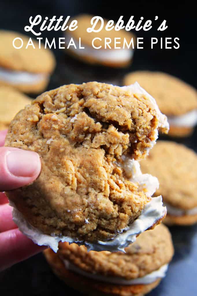 side view of homemade oatmeal cream pies with a bite taken out of one of the cookies