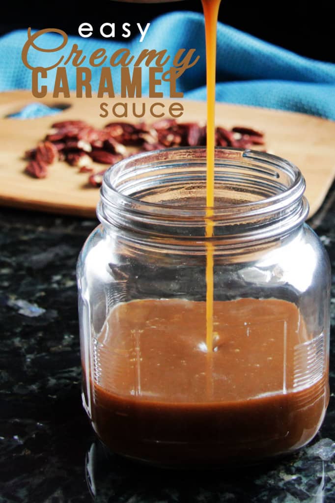 a thin stream of creamy caramel sauce being poured into a glass jar