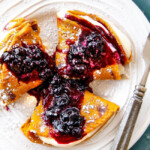 Easy Blender Brown Sugar Carrot Cake Crepes are my family's favorite crepes! Stuffed with silky sweet Cream Cheese and smothered in the most amazing Blueberry Sauce - these are addicting and so fun!!