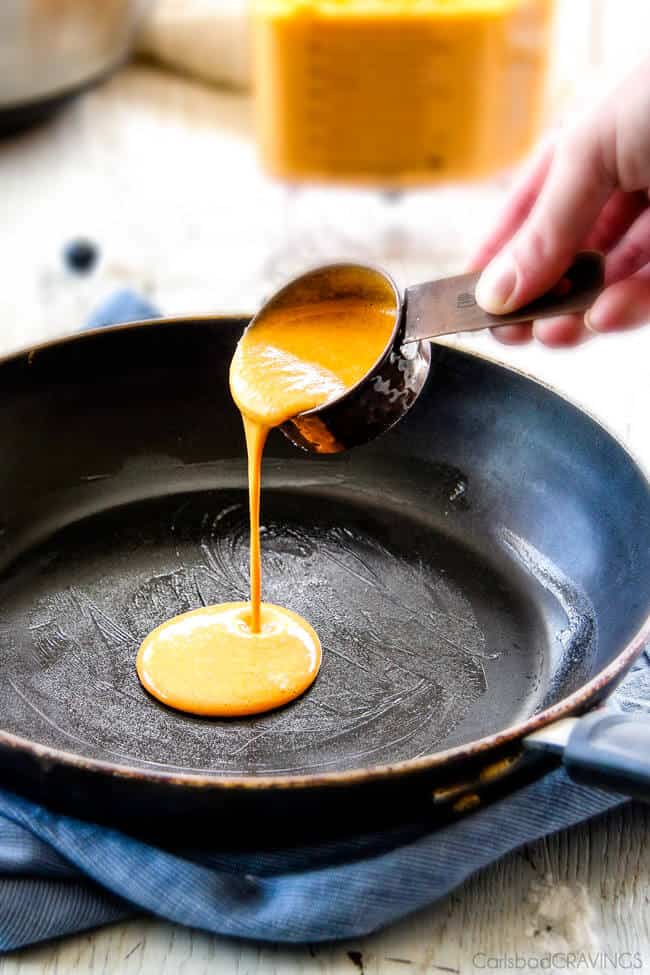 Pouring Carrot Cake Crepes in a pan to cook.