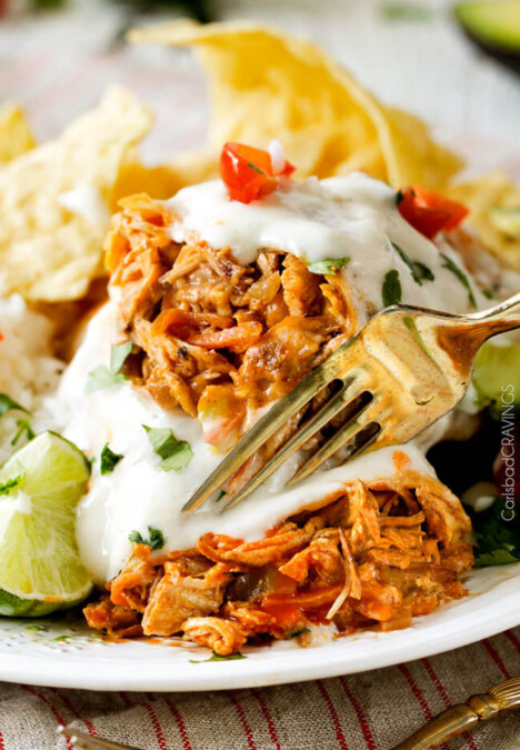 Smothered Baked BUFFALO Chicken Burritos AKA "skinny chimichangas" are restaurant delicious without all the calories! stuffed with the BEST buffalo chicken and then baked to golden perfection and smothered in most incredible Creamy Lime Ranch Sauce! my family goes crazy over these!!
