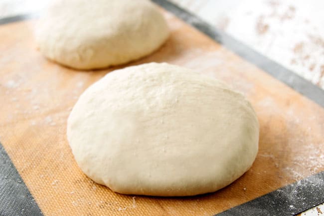Showing how to make Homemade Pizza Dough by dividing dough into balls to roll out. 