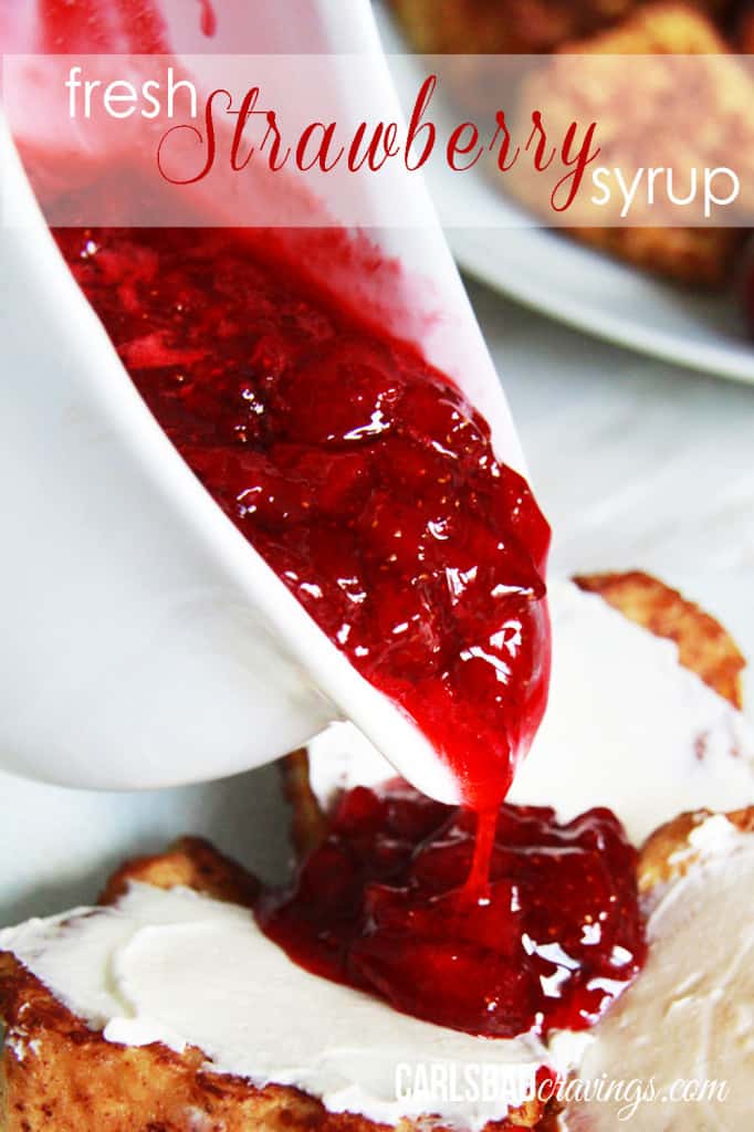Home made Strawberry Syrup being poured out of a white bowl over french toast. 