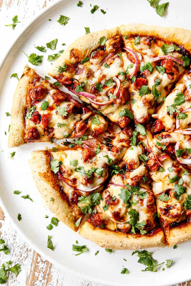 showing how to make pizza dough by adding BBQ sauce and chicken to pizza