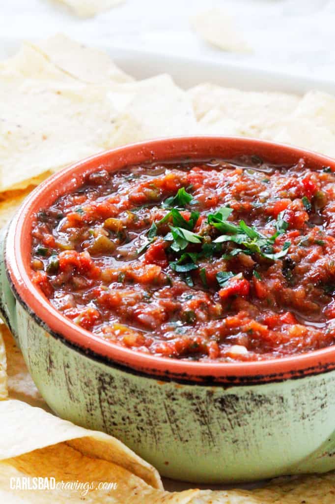 homemade salsa in small dish next to tortilla chips
