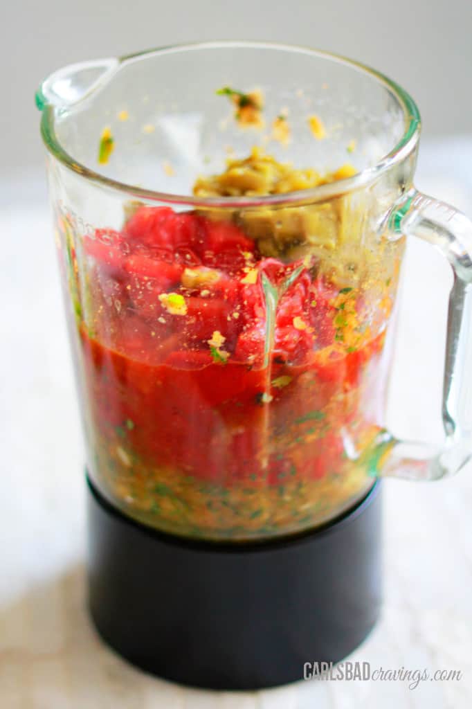 showing how to make homemade salsa by adding fire roasted tomatoes and green chiles to blender