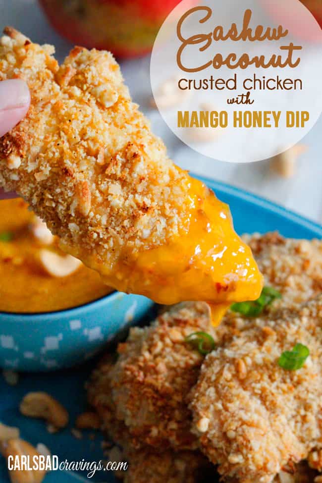 Baked Coconut Crusted Chicken being dipped in mango dip