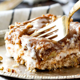 This Toffee Caramel Ice Cream Cake is amazing and so easy! I love the pecan cookie crumble and the caramel sauce is out of this world! Perfect make ahead dessert!