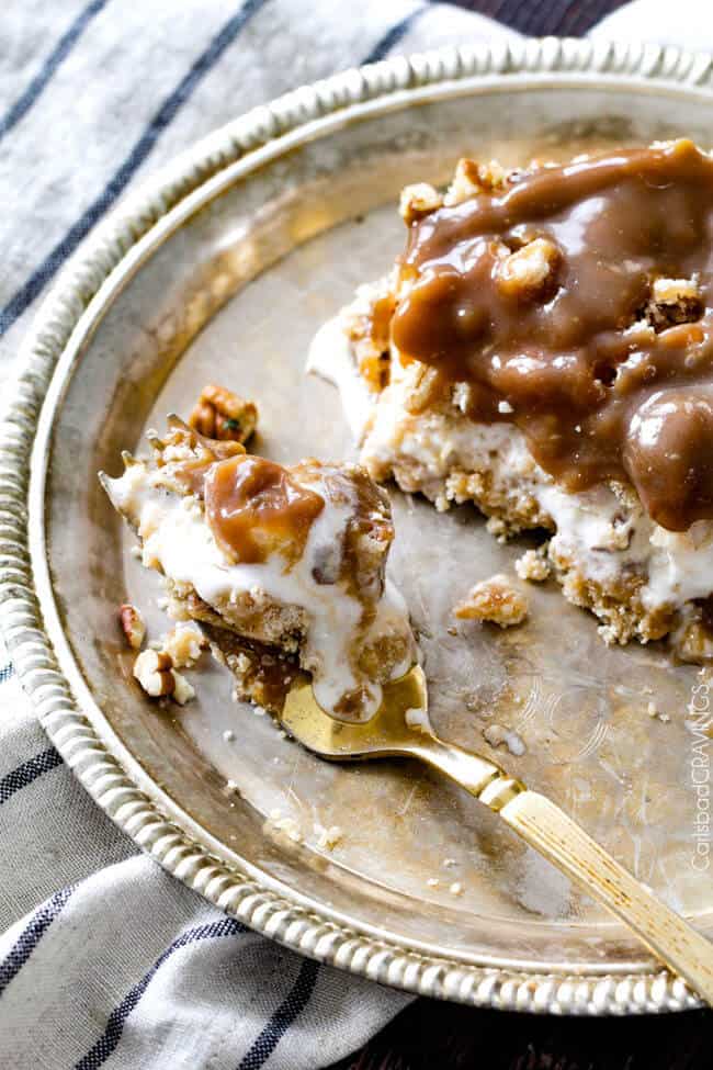 a fork laying on a plate with a bite of homemade ice cream cake recipe