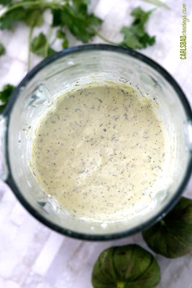 showing how to make avocado ranch dressing by blending until smooth