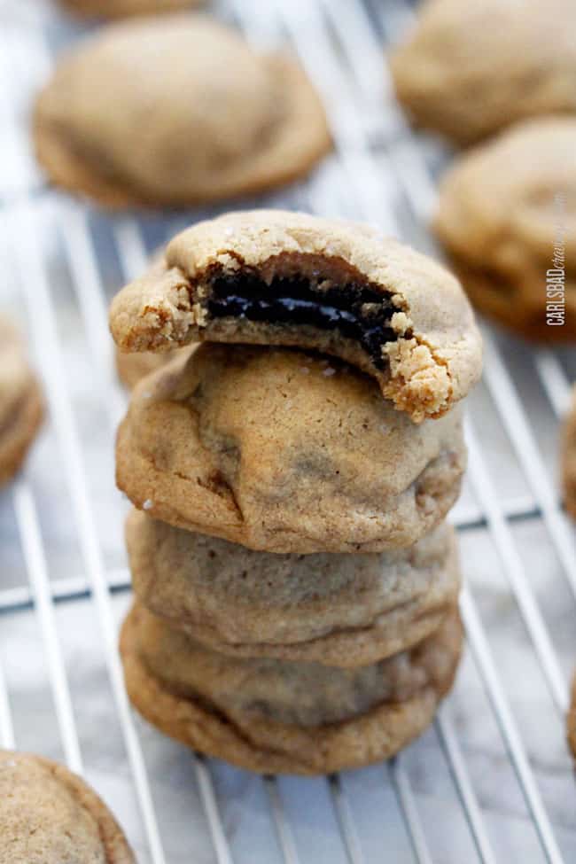 a stack of best Oreo Stuffed Cookies cooling on a baking rack