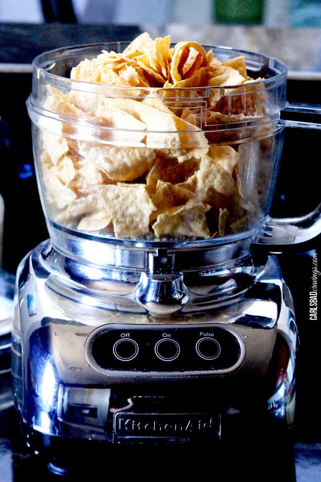 Showing how to make Nacho Chicken by putting tortilla ships in a blender.