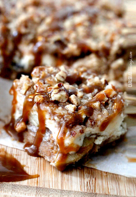 Candy Apple Cheesecake Bars on a wooden board.
