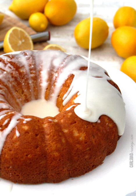 Drizzling lemon glaze on Lemon Poke Cake.