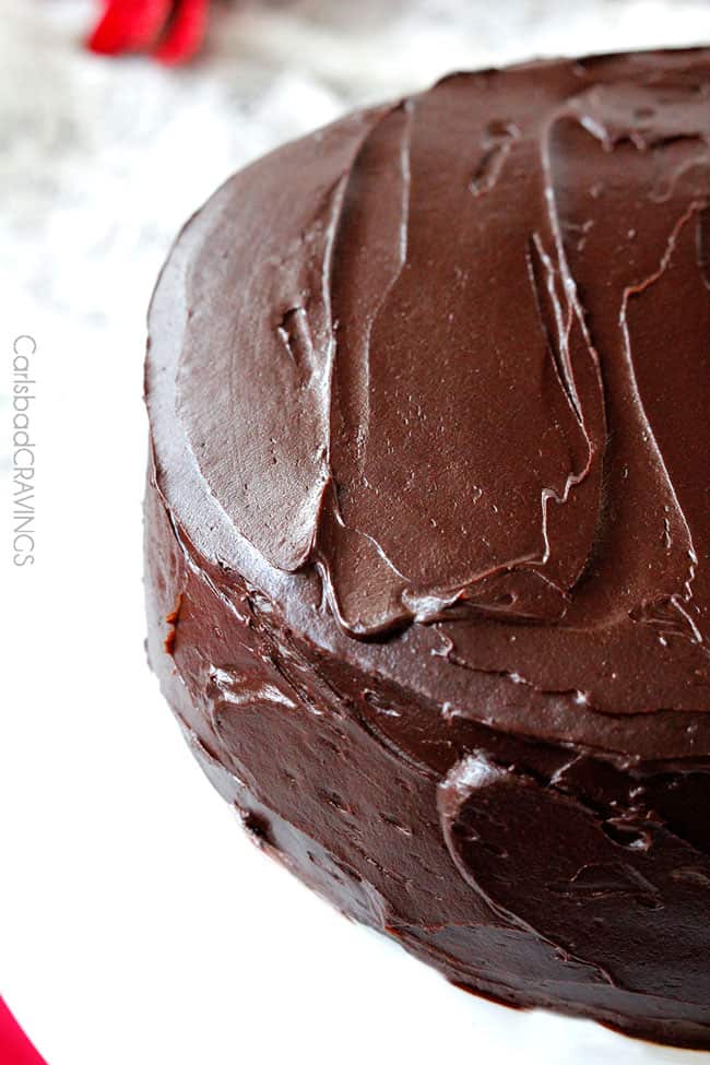 showing how to make Chocolate Peppermint Cake by frosting with chocolate ganache