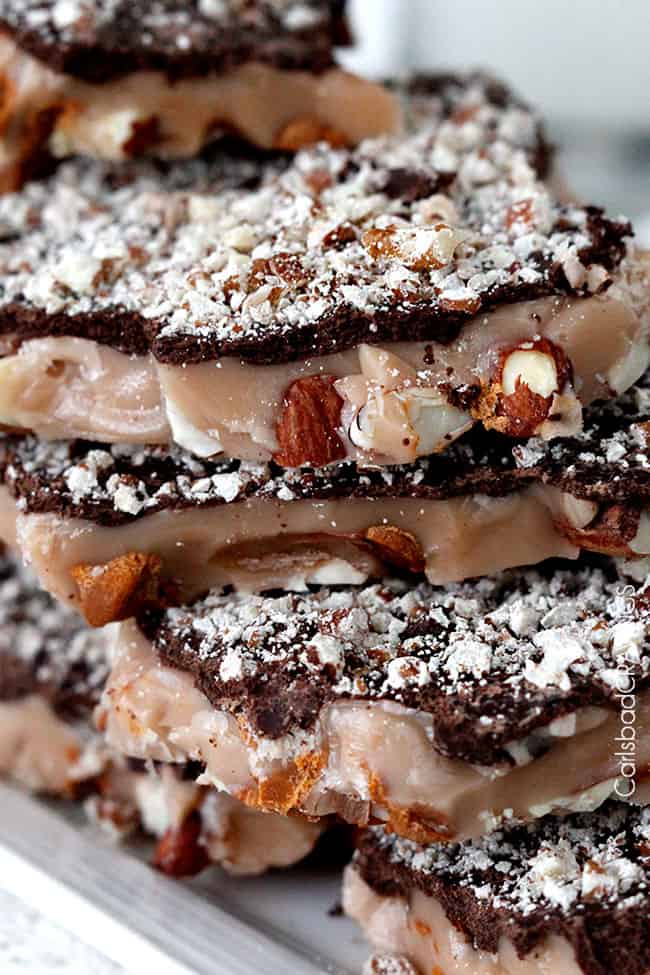 Extreme close up of English Toffee with Chocolate, Almonds and Pecans showing nuts and toffee.