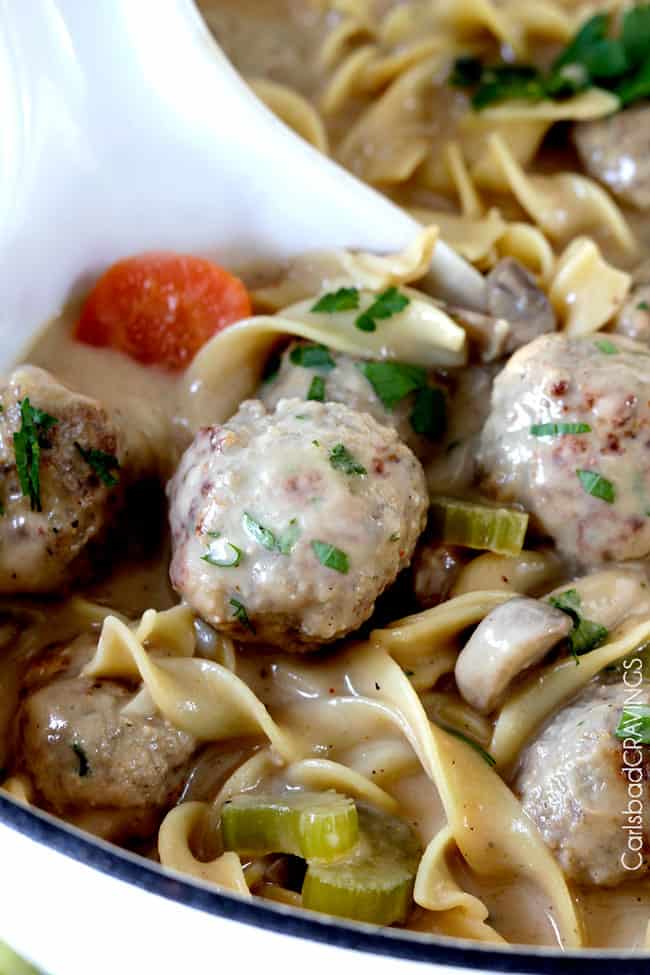 up close of a spoon picking up easy meatball soup