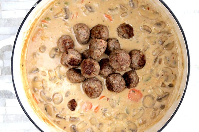 showing how to make meatball soup by adding meatballs to simmer in the soup