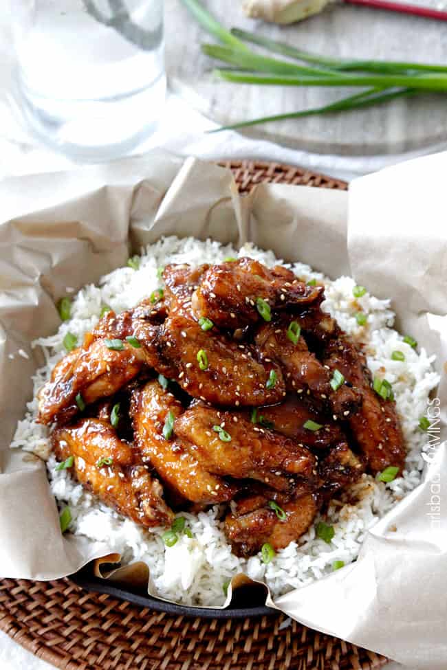 showing how to serve baked chicken wings by garnishing with green onions