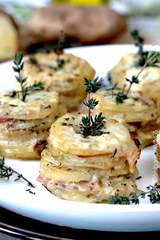 ham and potato stacks on a white plate 