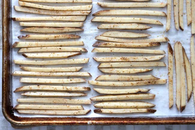 Showing how to make Baked Mexican French Fries on a baking pan.