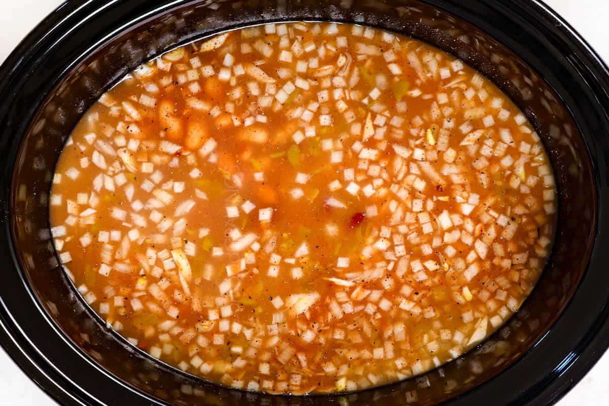 showing how to make chicken chili by slow cooking until chicken is tender
