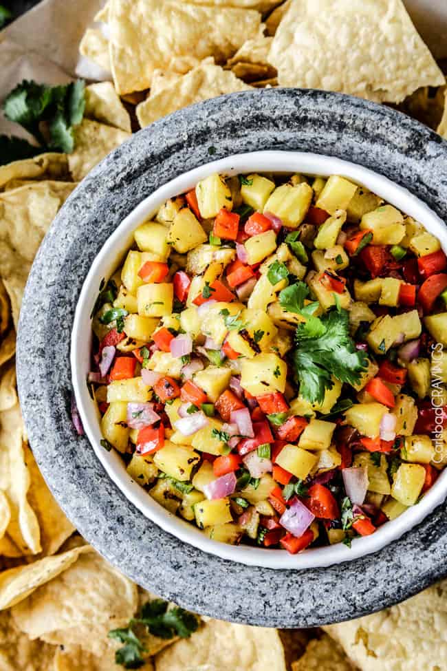 Sweet and smoky Grilled Pineapple salsa with not only grilled pineapple but GRILLED red bell peppers, red onions AND jalapeno! sweet and smoky and possibly the best salsa E-V-E-R alone, with chips, tacos or on fish/chicken. #pineapple #salsa #pineapplesalsa #grill