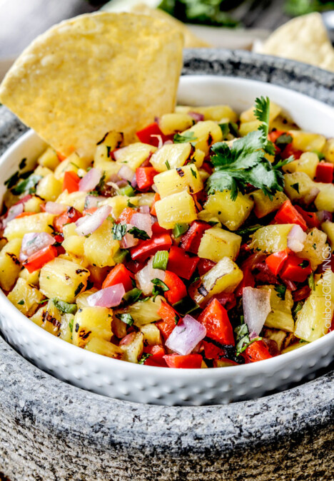 Sweet and smoky Grilled Pineapple salsa with not only grilled pineapple but GRILLED red bell peppers, red onions AND jalapeno! sweet and smoky and possibly the best salsa E-V-E-R alone, with chips, tacos or on fish/chicken. #pineapple #salsa #pineapplesalsa #grill