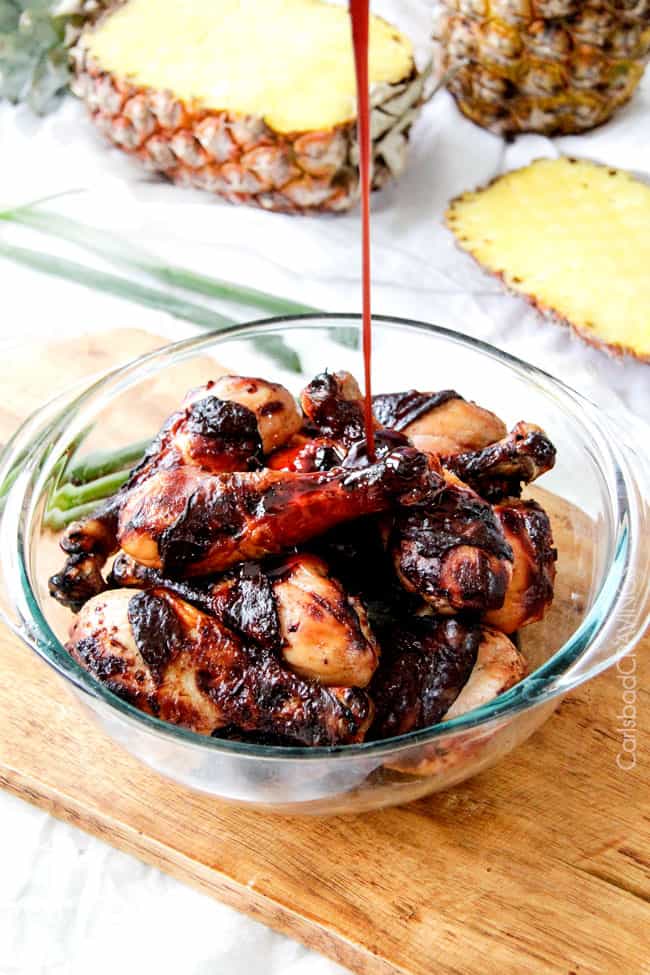 Showing how to make Honey Jalapeno Chicken wings in a bowl pouting sauce over top.