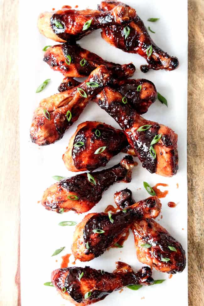 Top view of several Honey Jalapeno Chicken wings on a white plate. 