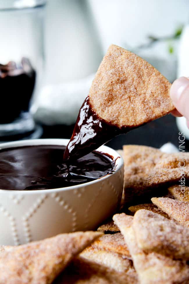 Chocolate Sauce being dipped with cinnamon sugar dough chips.