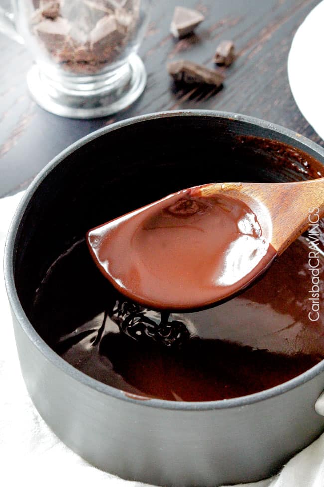 Showing how to make Chocolate Sauce by putting melting chocolate chunks in a sauce pan.