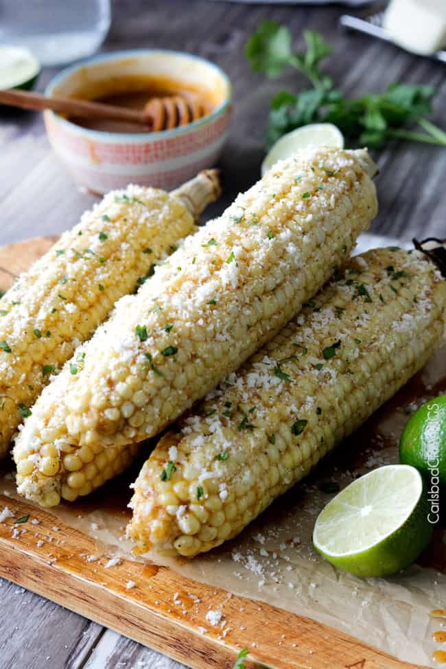 Four corn cobs and lime Grilled Corn on the Cob with Chipotle Honey Lime Butter