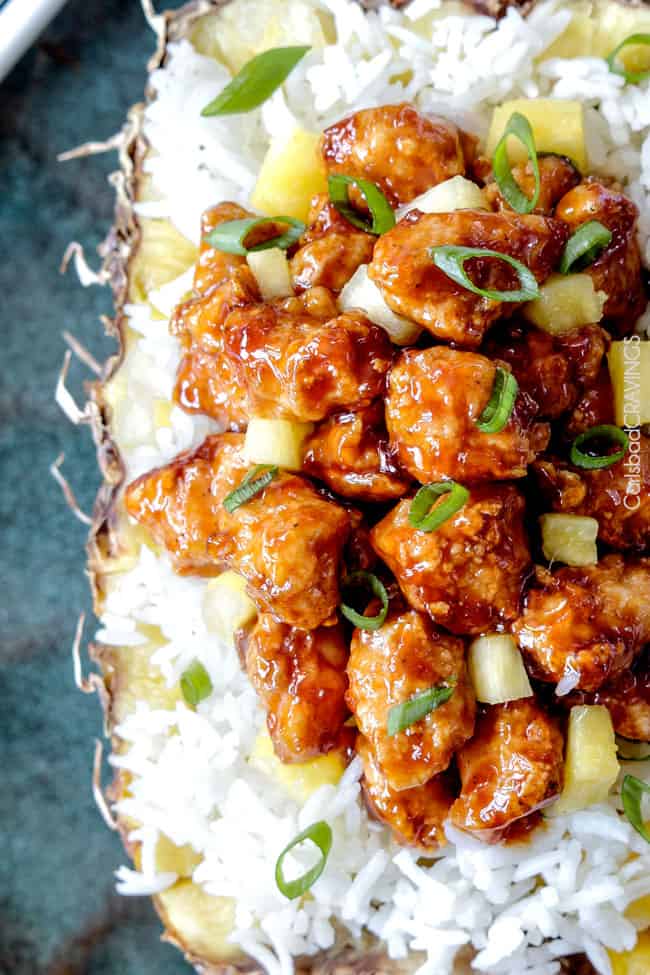 top view of Baked Chinese Pineapple Chicken Recipe with green onions and white rice. 