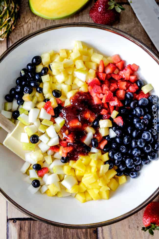 Light and refreshing Rainbow Fruit Salsa (No Bake) Cheesecake Dip is the perfect make ahead dessert/appetizer that no one will be able to stop munching! #cheesecakedip #cheesecake #dip #appetizer #fruitsalsa