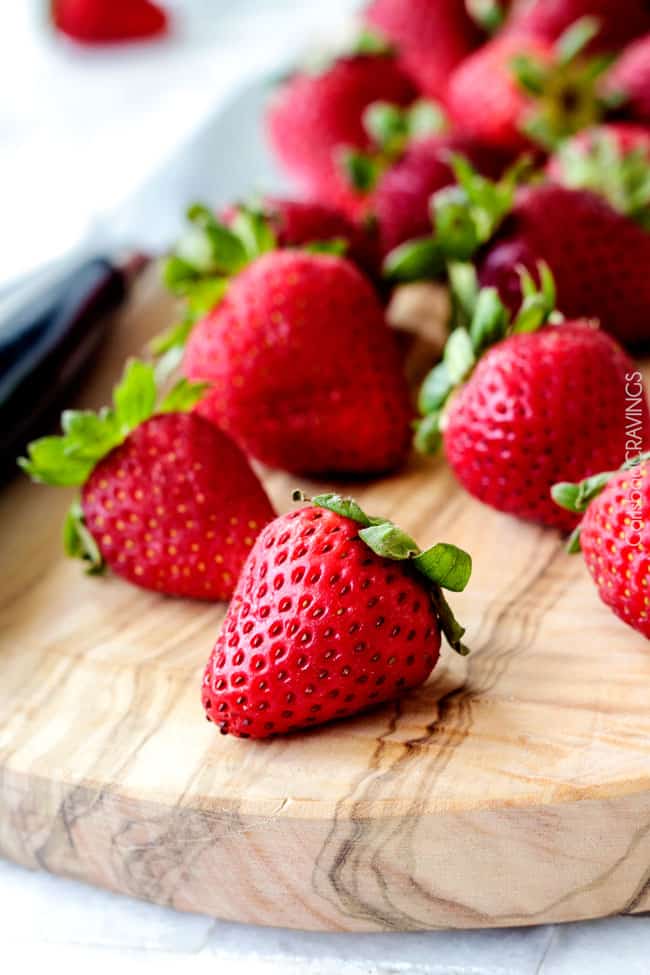 Fresh strawberries on a wooden board. 