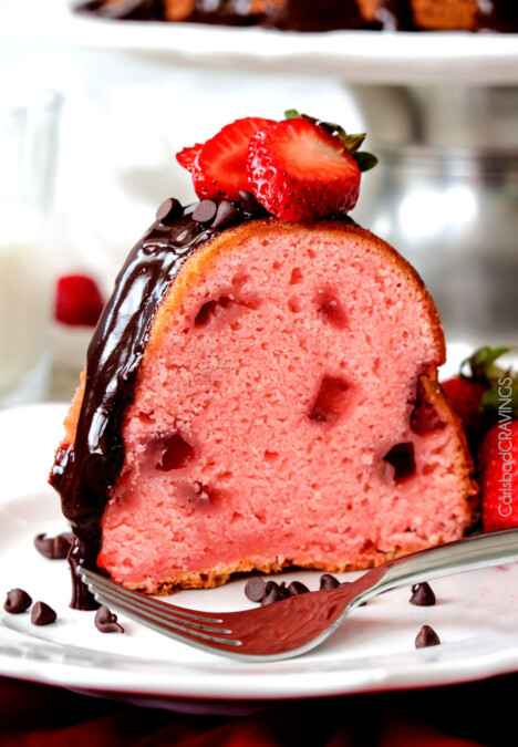 Rich, buttery, tender Strawberry Pound Cake swirled with fresh strawberries and smothered in smooth, silky Chocolate Ganache. 1000X better than any cake mix and so drool worthy everyone will beg you for the recipe!