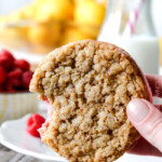 Two large, soft, chewy buttery lemon oatmeal cookies sandwiching creamy raspberry frosting = AMAZING!