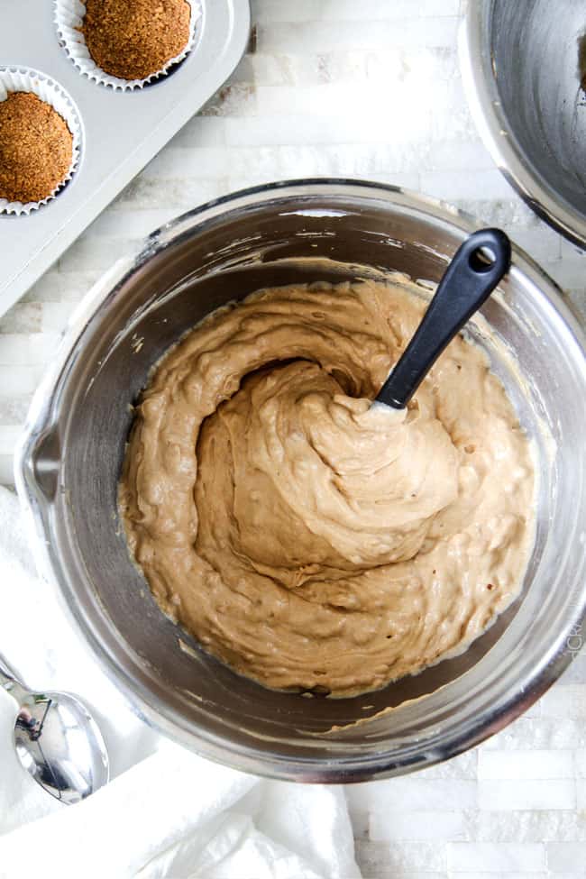 Stirring Chocolate Peanut Butter Pie filling with heavy cream, cream cheese and peanut butter together until smooth