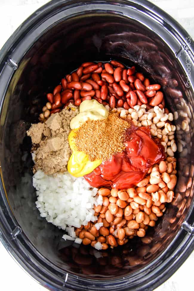 Showing how to make Hawaiian Barbecue Baked Beans in a slow cooker by including all the raw ingredients.