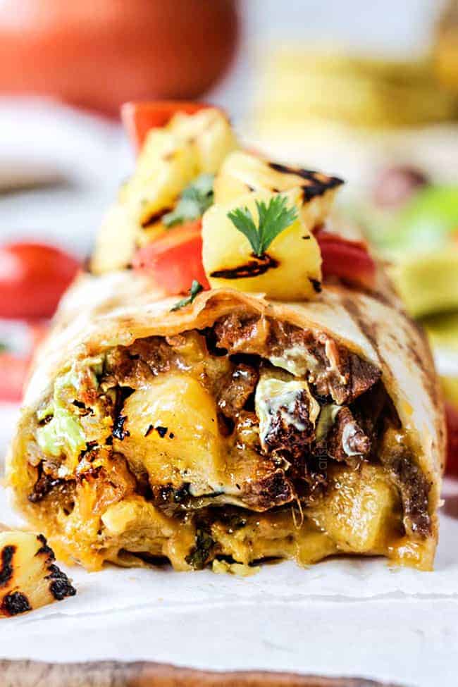 Massive San Diego burrito with carne asada, fries, and toppings