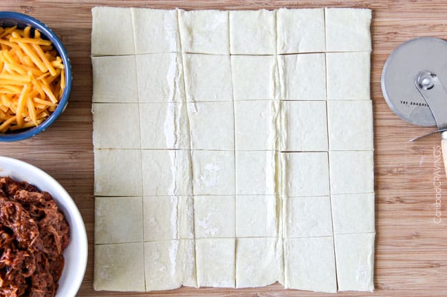 Showing how to make BBQ Brisket Bites by cutting dough squares.