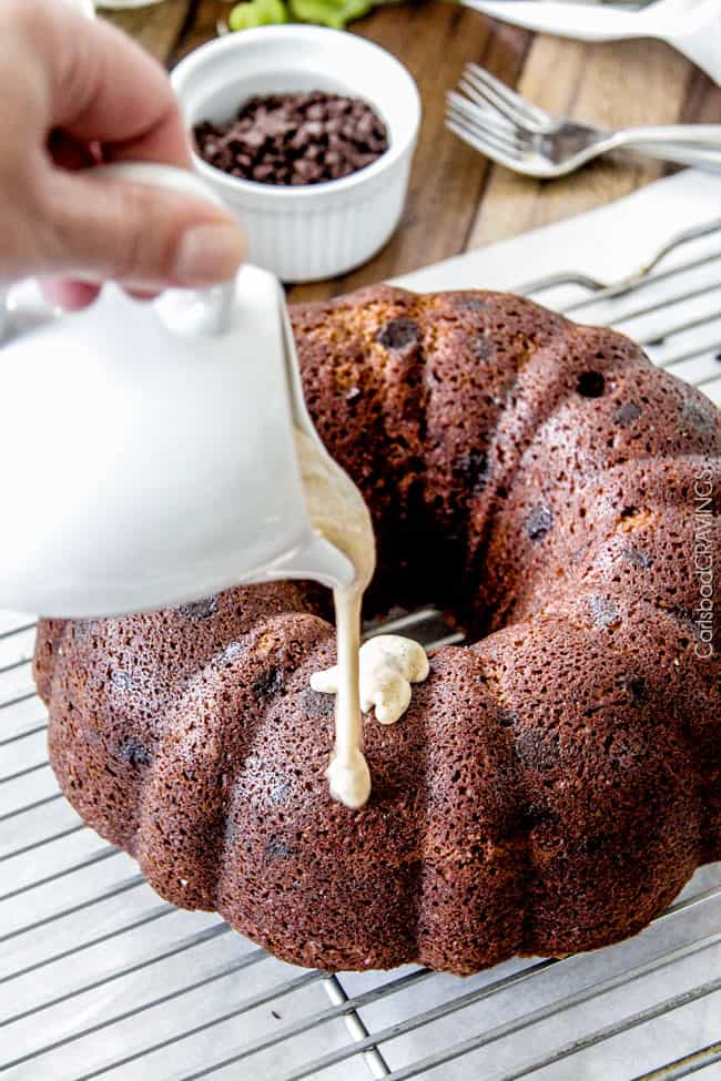 showing how to make Pumpkin Bundt Cake by drizzling Cream Cheese Glaze over cake