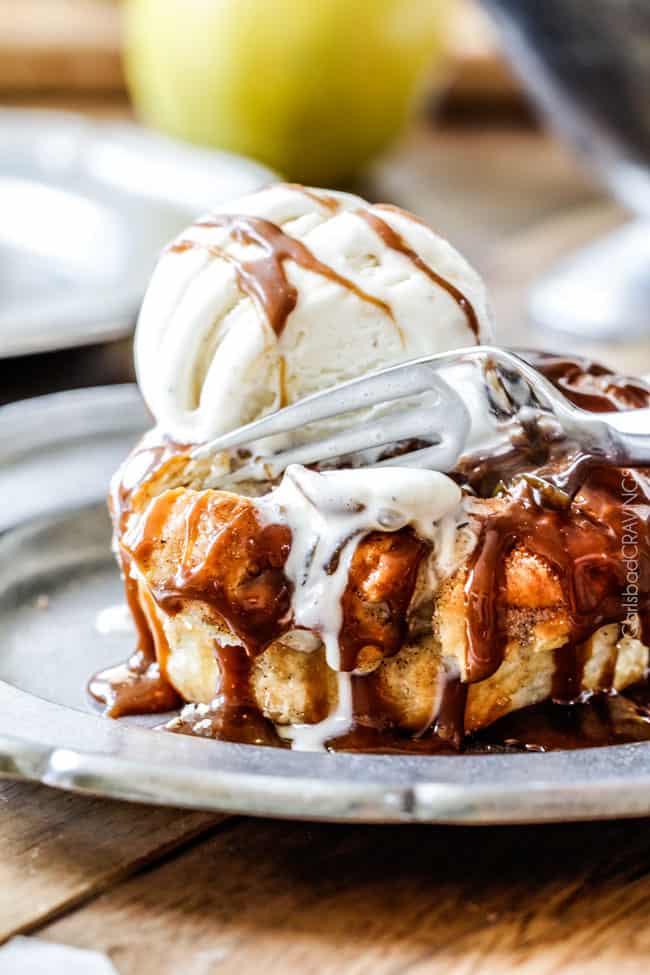 showing how to serve apple dumplings by topping with vanilla ice cream